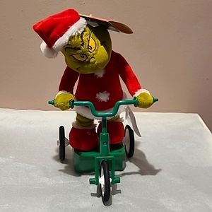 Animated Grinch Riding bicycle Brand New With tags. Price is firm!!